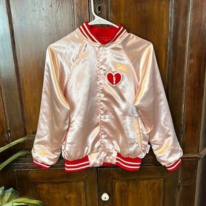Tuesday Bassen pink and red silk baseball jacket with embroidered broken heart